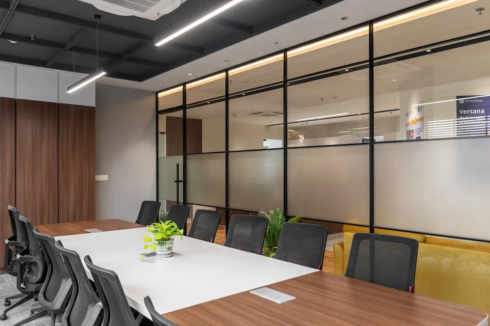 Meeting room separated by framed glass walls
