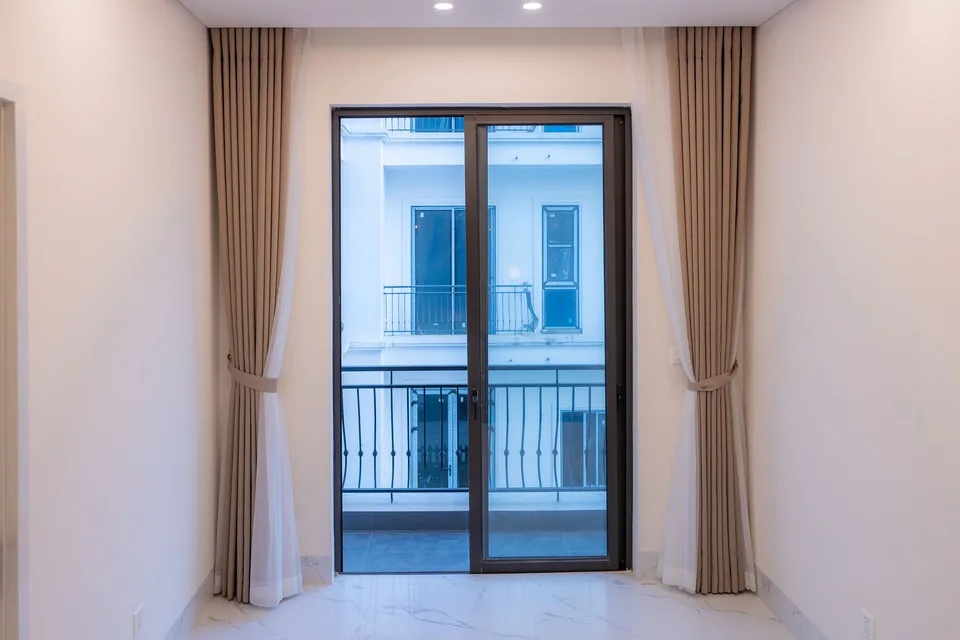 Interior looking through a glazed balcony doorway